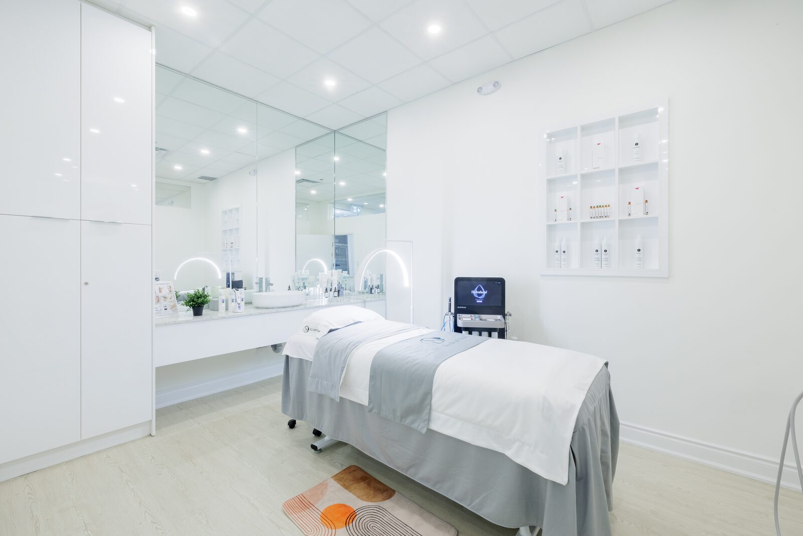 Quiet single-bed treatment room with soft towels and facial care station